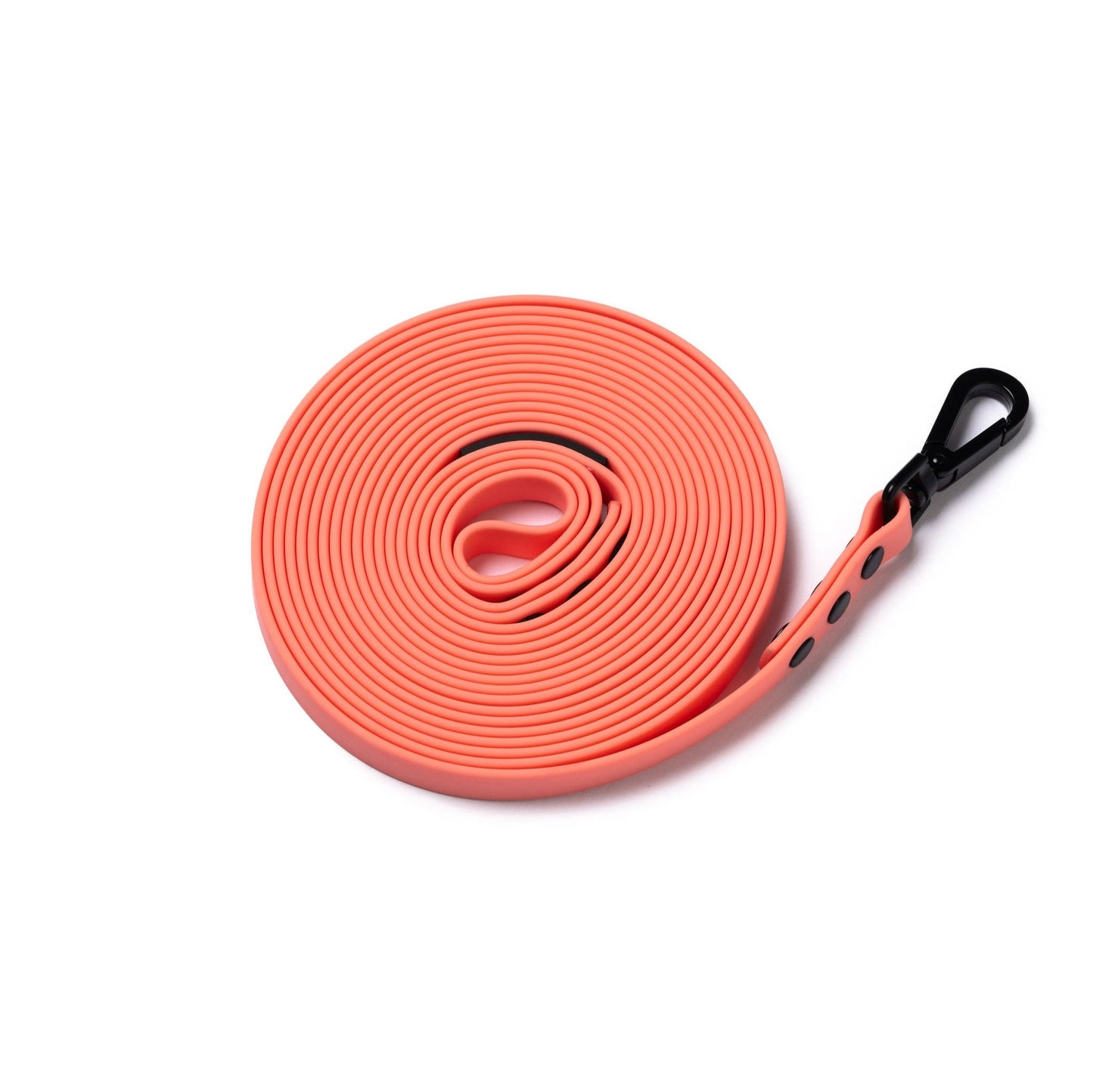 Picture of a coral 5m rubber coated lead rolled up and laid flat on a white background.