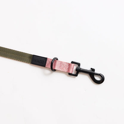 Close up of the small dog hands free lead clip in olive and pink.