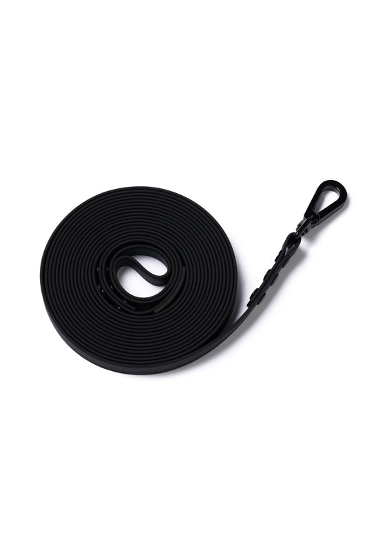 A black 5m rubber coated lead rolled up and laid flat on a white background.