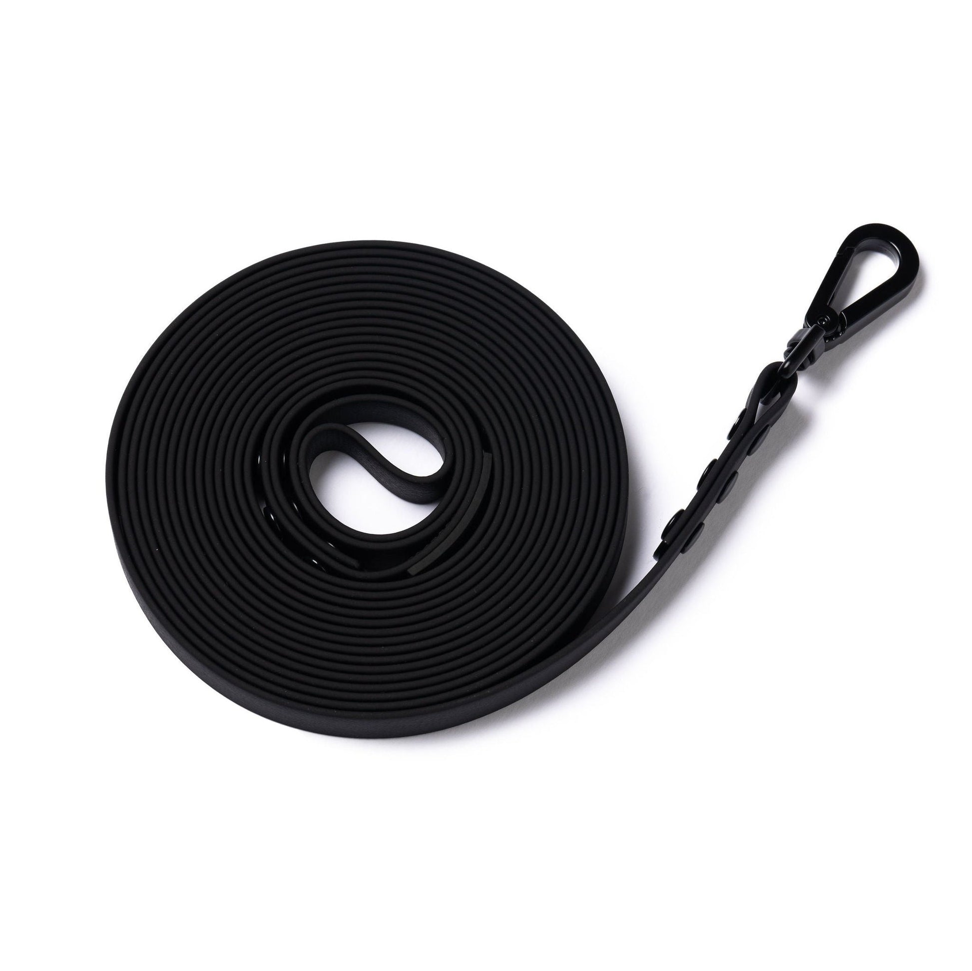 A black 5m rubber coated lead rolled up and laid flat on a white background.